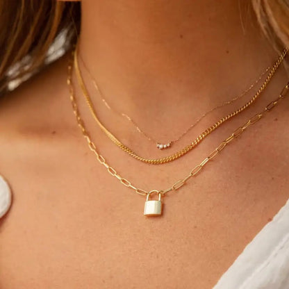 Lock Pendant Necklace styled for casual or formal looks, adding a modern touch.