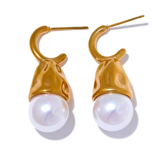 Close-up of Pearl Drop Earrings showcasing contemporary design with polished gold finish and pearl accents.