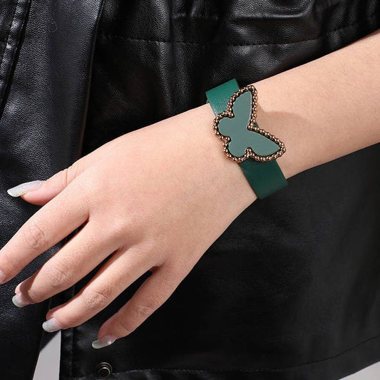 Butterfly Acrylic PU Leather Bracelet in green, styled on a wrist for a playful and chic accent to any outfit.
