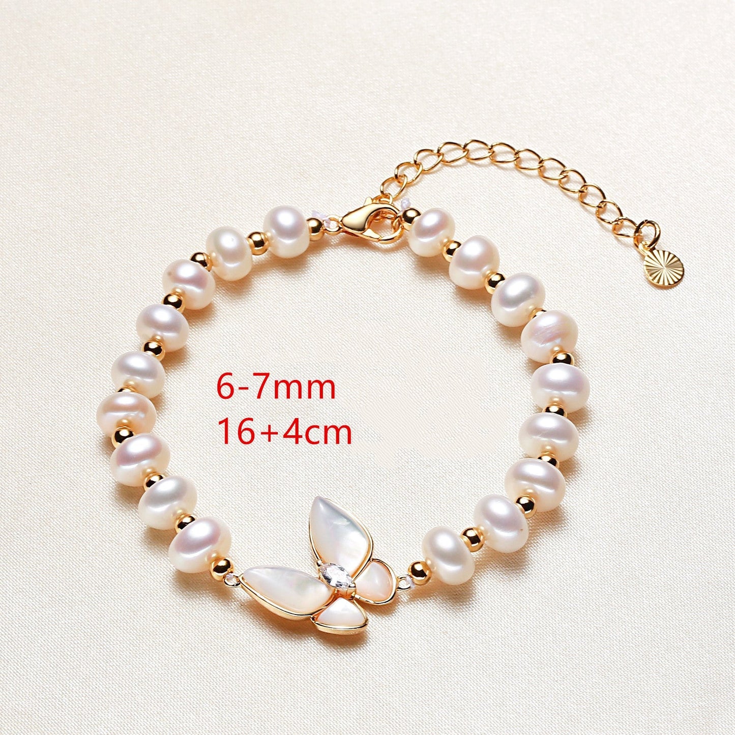 Details for the Close-up of the Butterfly Bliss Bracelet's mother-of-pearl butterfly charm.
