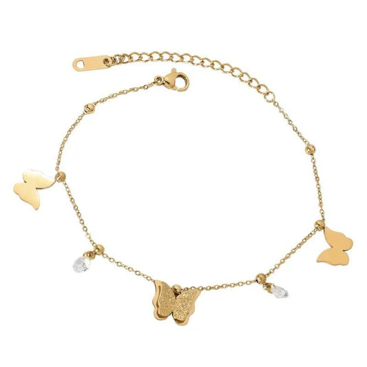 Butterfly Dreams Anklet with 18K gold-plated chain, adorned with butterfly charms and sparkling crystal drops, featuring an adjustable design.