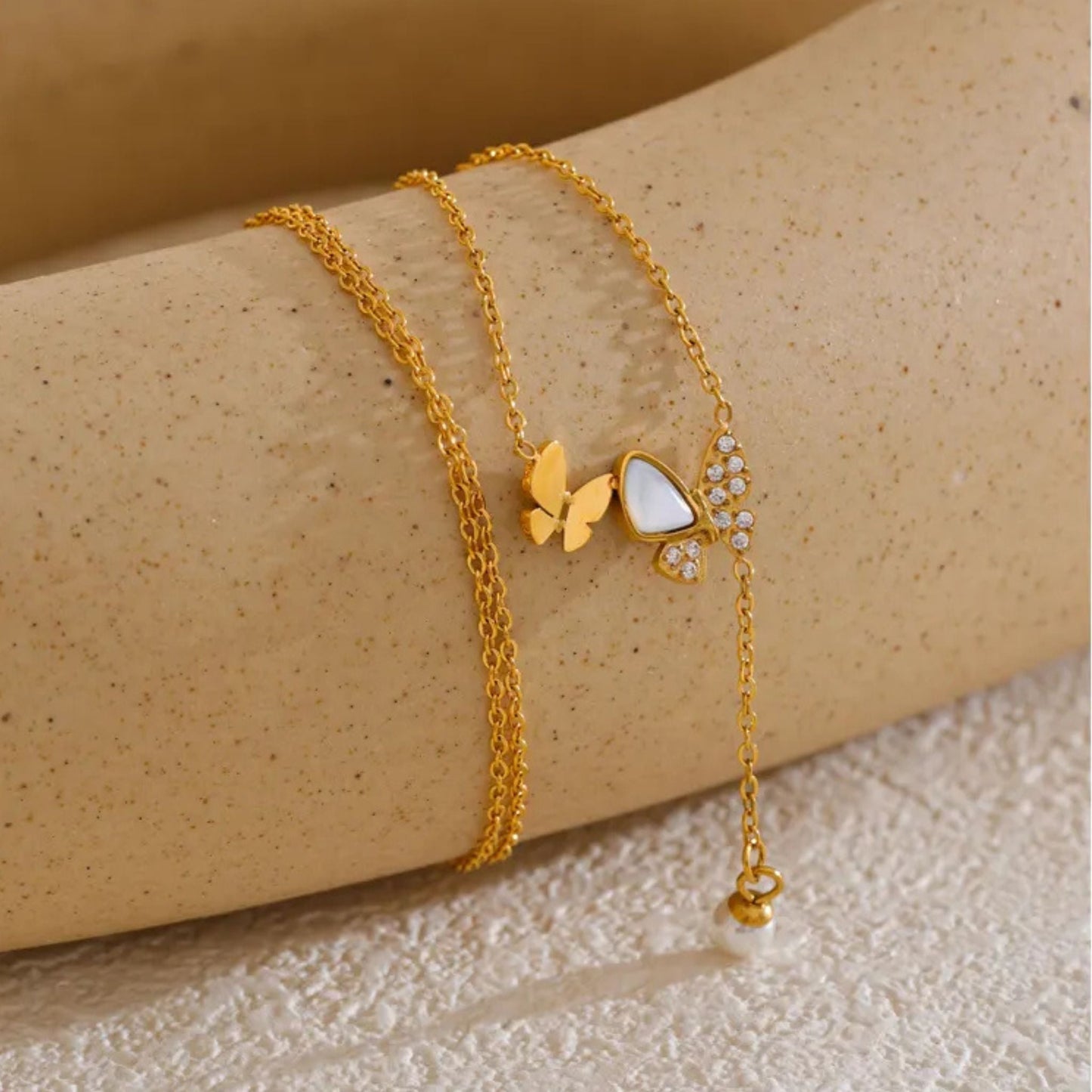 Close-Up of Butterfly Necklace with Natural Shell and Pearl Drop