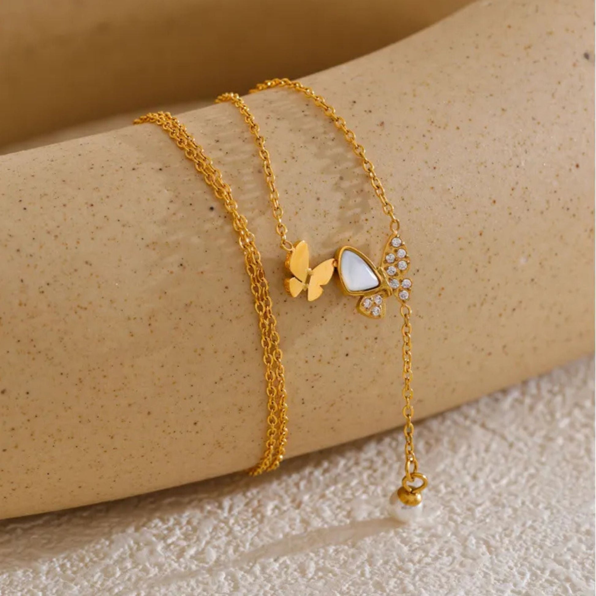 Close-Up of Butterfly Necklace with Natural Shell and Pearl Drop