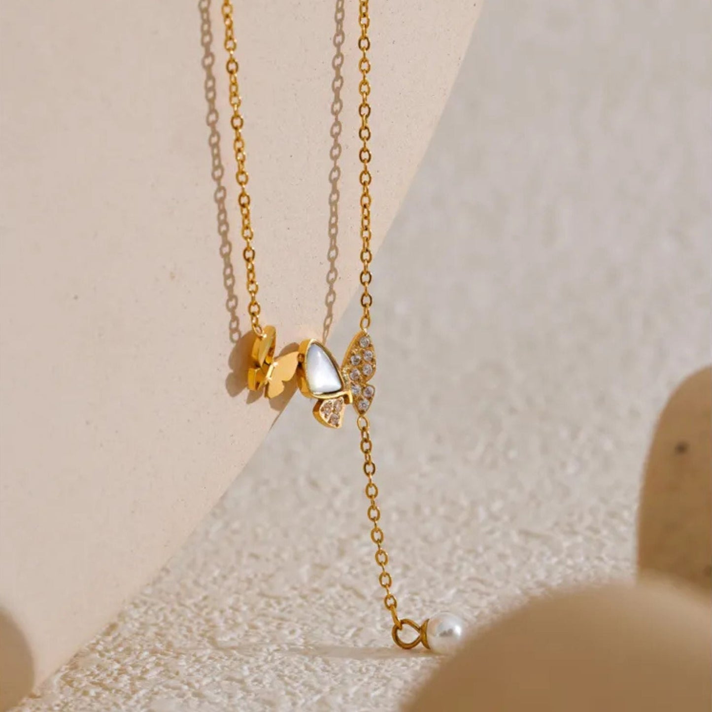 Close-Up of Butterfly Necklace with Natural Shell and Pearl Drop