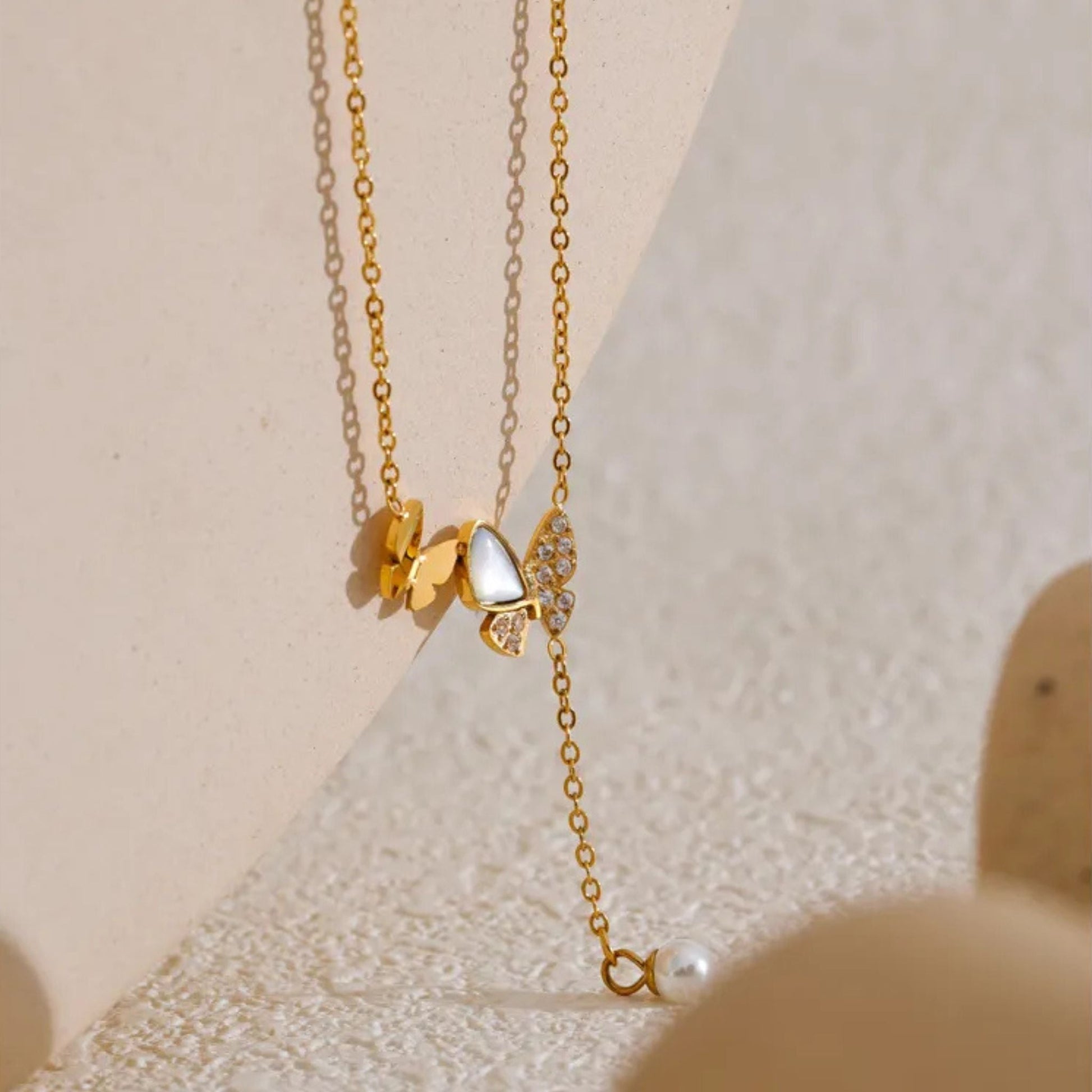 Close-Up of Butterfly Necklace with Natural Shell and Pearl Drop