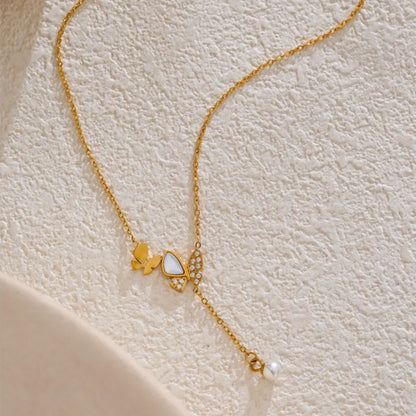 Side View of Butterfly Pendant Necklace with Pearl and Shell