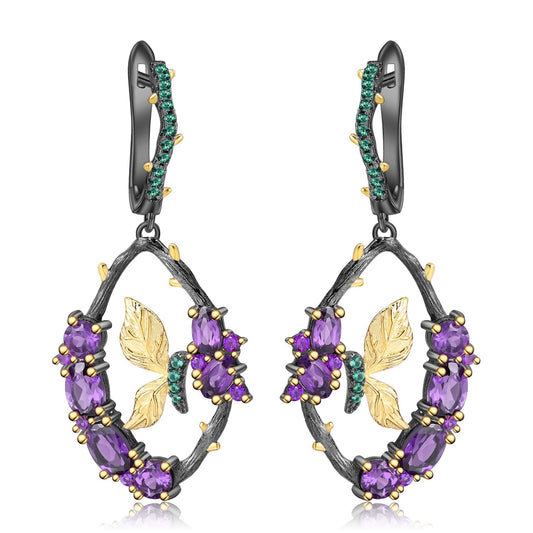 Amethyst and Emerald Sterling Silver Earrings featuring a branch motif with natural amethyst and nano emerald stones, crafted in 925 sterling silver with black gun and gold plating.
