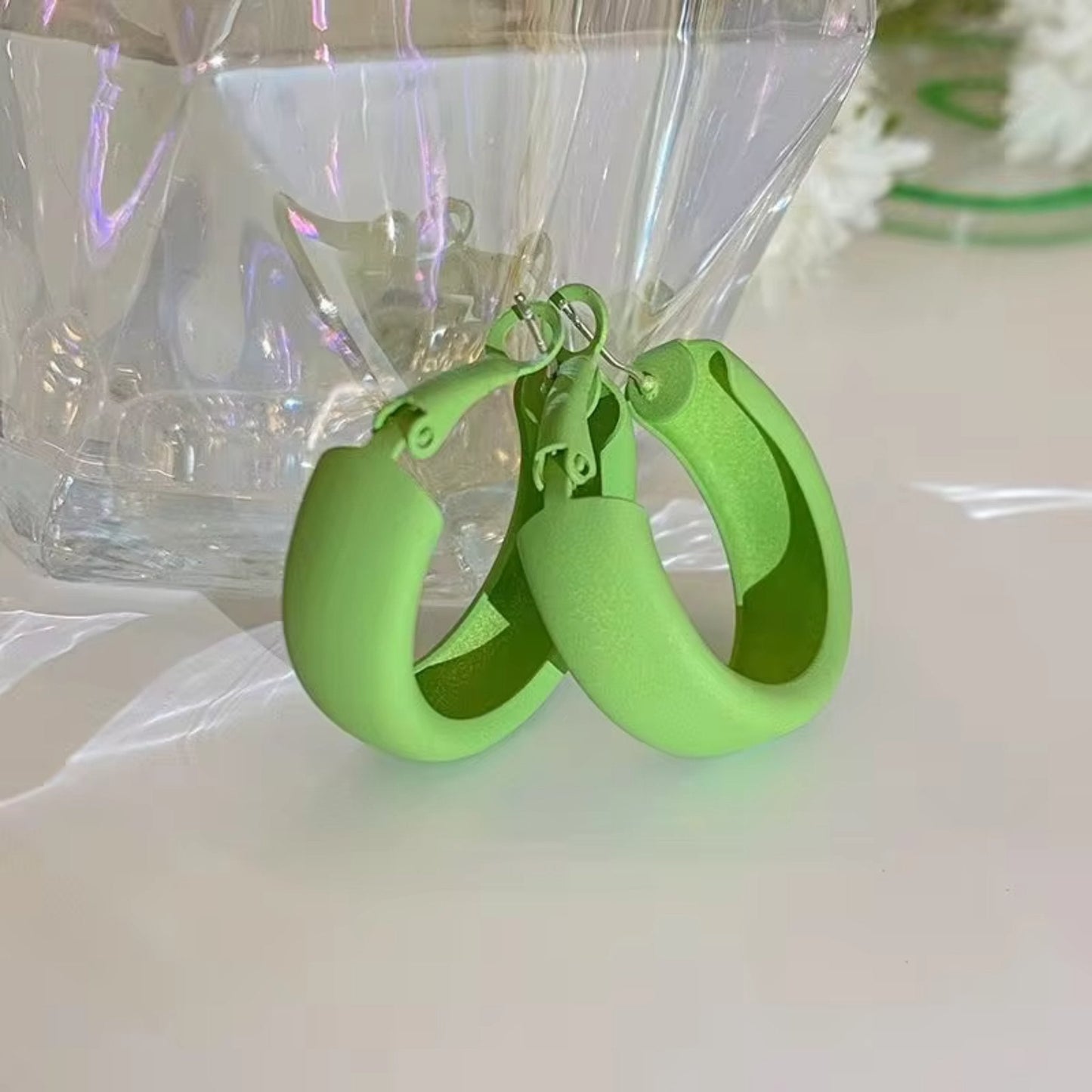 Candy Color Circle Acrylic Earrings in fresh green, crafted from lightweight acrylic with a secure clasp closure.