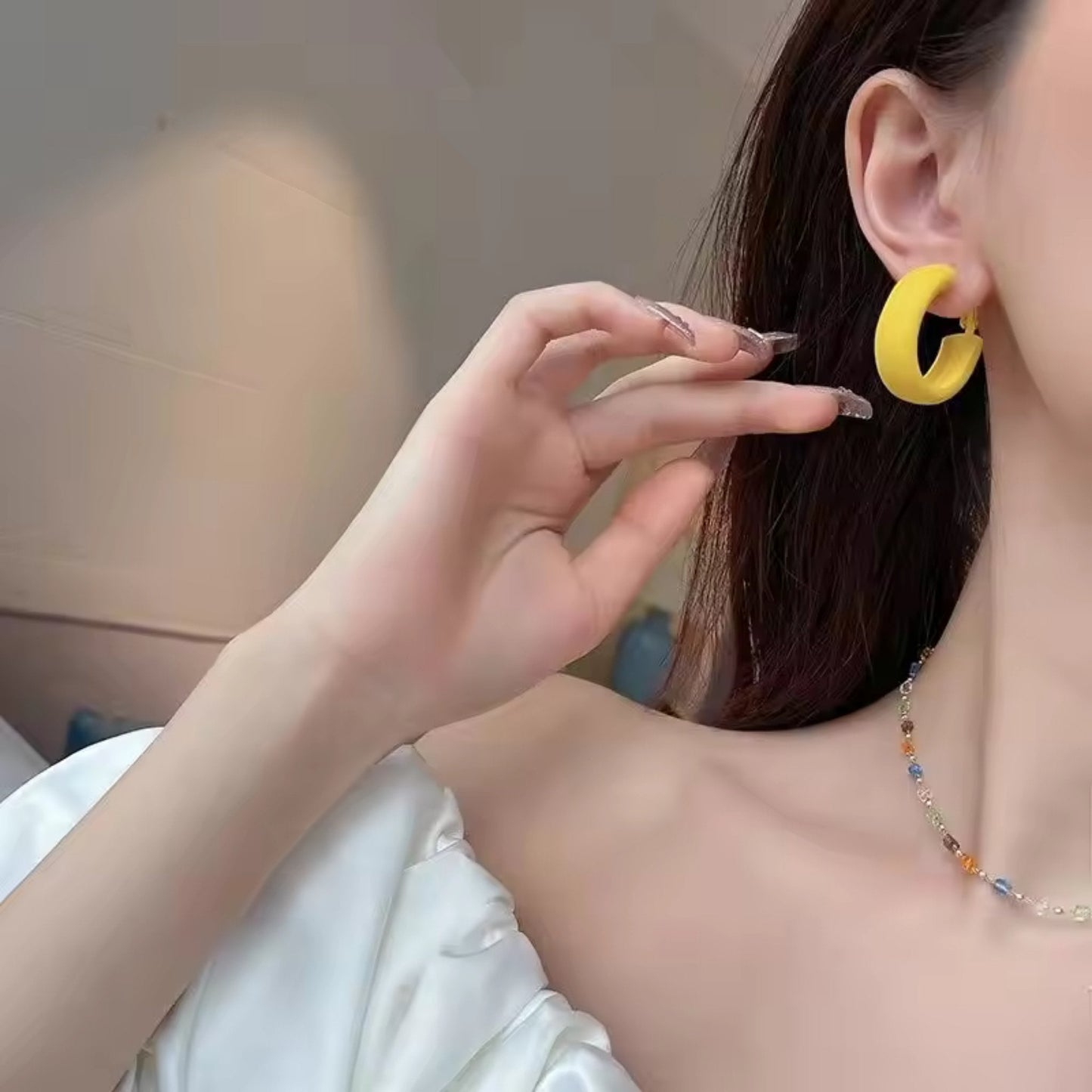 Candy Color Circle Acrylic Earrings in lively Yellow, styled on a model for a playful and fashion-forward look.