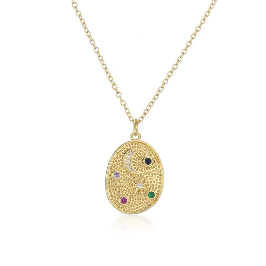 Celestial Charm Pendant Necklace featuring a gold-plated pendant with celestial symbols and colorful cubic zirconia stones on an 18K gold-plated chain.