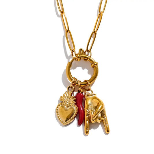 Charm of Fortune Necklace with gold-plated paperclip chain and symbolic charms, including a sacred heart, red chili pepper, and hand gesture.