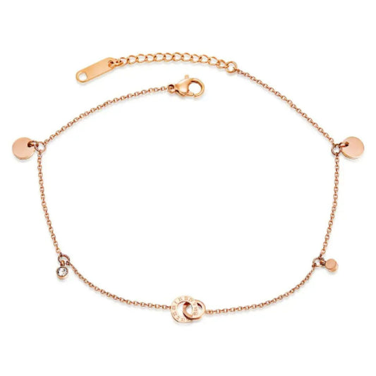 Circle of Love Anklet in 18K rose gold plating with round charms, interlocking rings, and two sparkling white zircons.