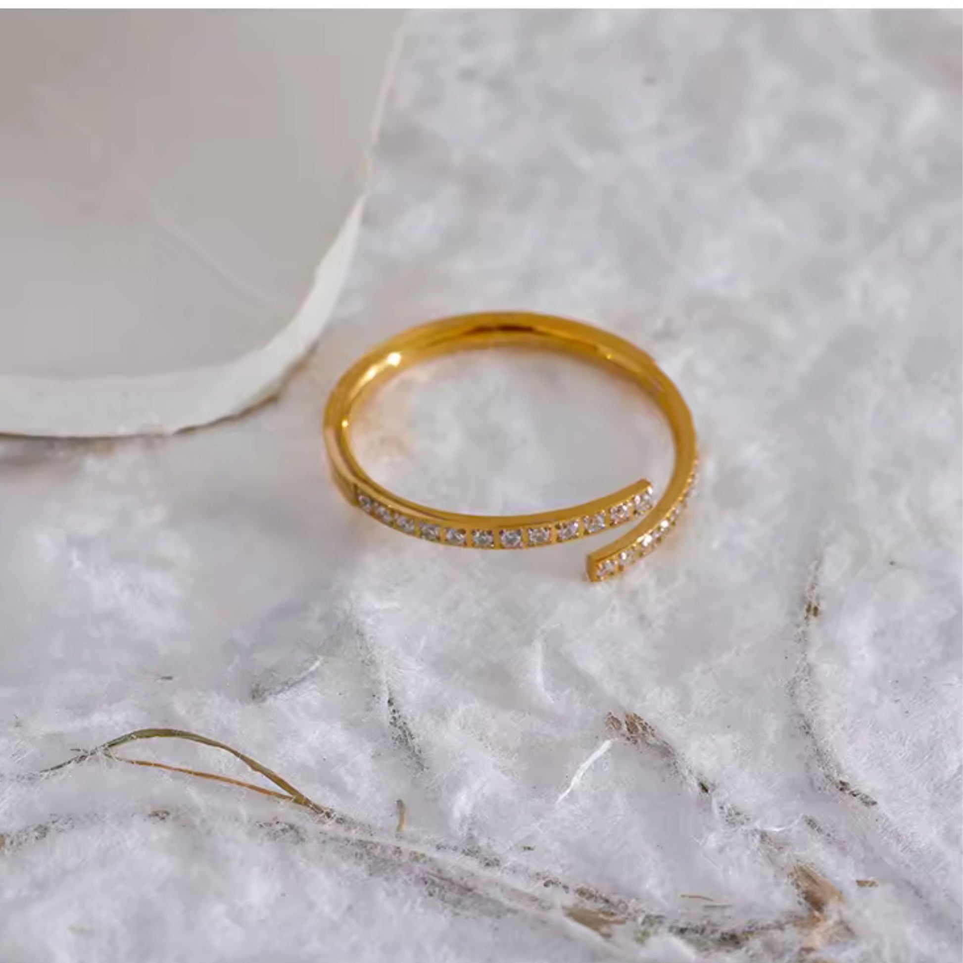 Close-up of the clear crystals on the Classic Open-Cuff Crystal Ring, highlighting its elegant and refined design.