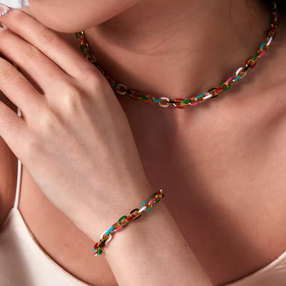Color Splash Enamel Cuban Chain Necklace and Bracelet styled on a model, showcasing its bold multicolor design and luxurious gold finish.