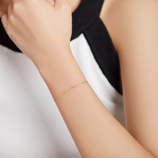 Colorful Harmony Bracelet styled on a wrist, highlighting its delicate design and colorful accents.