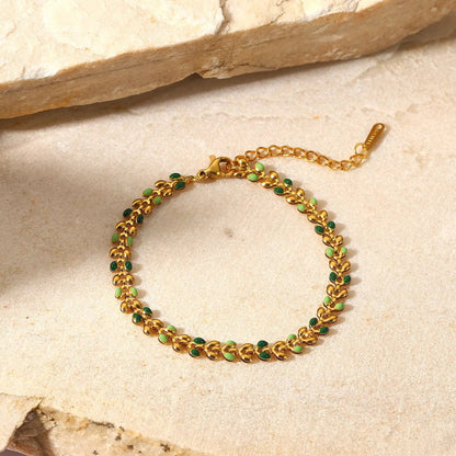 Close-up of the delicate leaf-shaped links with colorful oil drop accents on the Colorful Leaf Drop Bracelet.