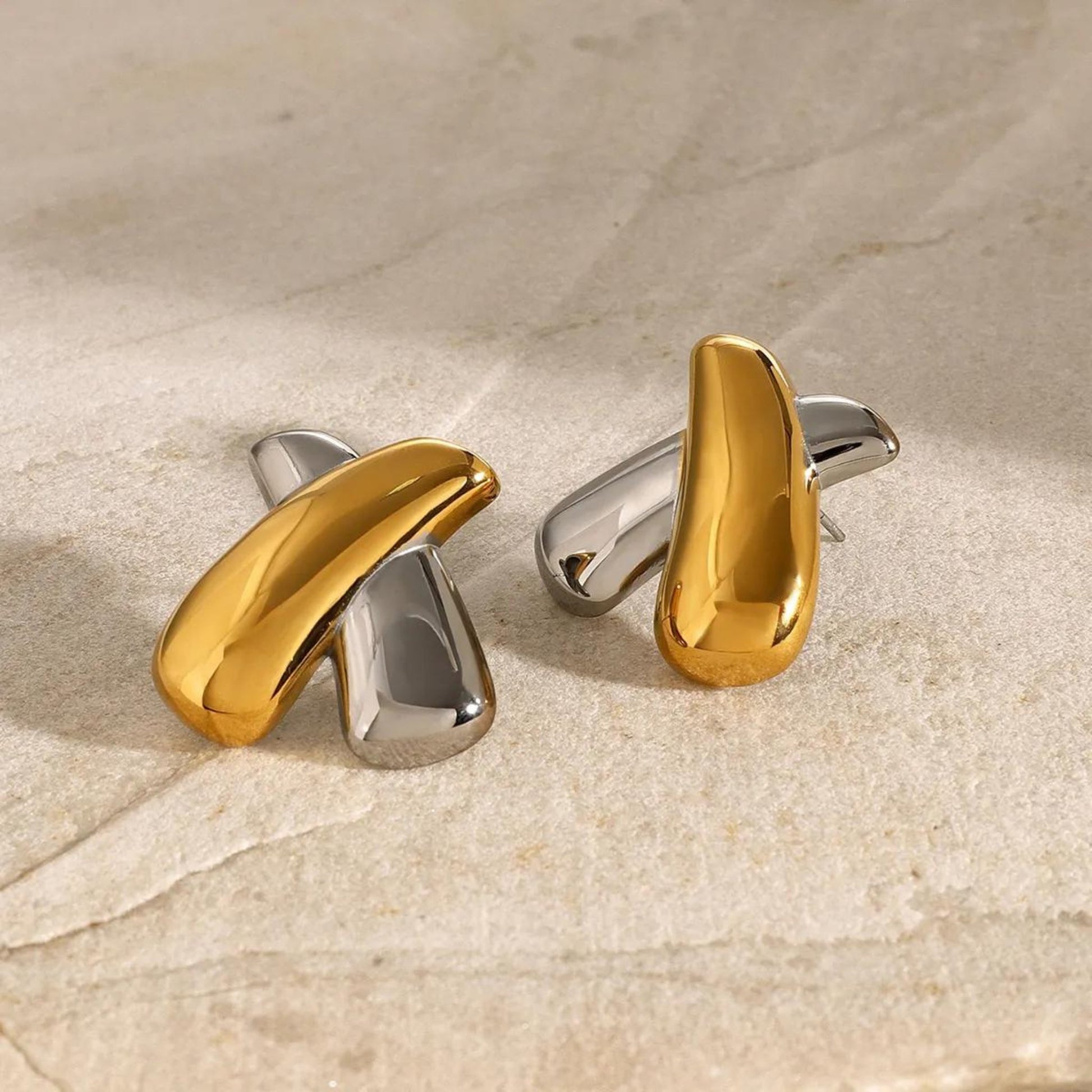 Crossed Elegance Dual-Tone Earrings in a bold Gold & Silver mix, perfect for adding a modern touch to any outfit.
