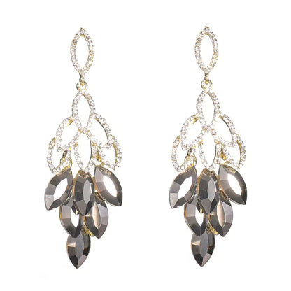 Crystal Cascade Drop Earrings with faceted crystals and cubic zirconia on an 18K gold-plated alloy base.
