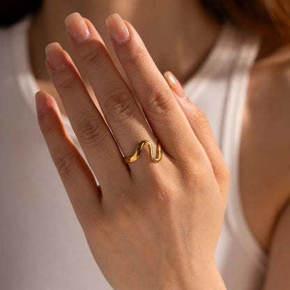 Stacked Curved Arc Rings styled on a model for a chic look.