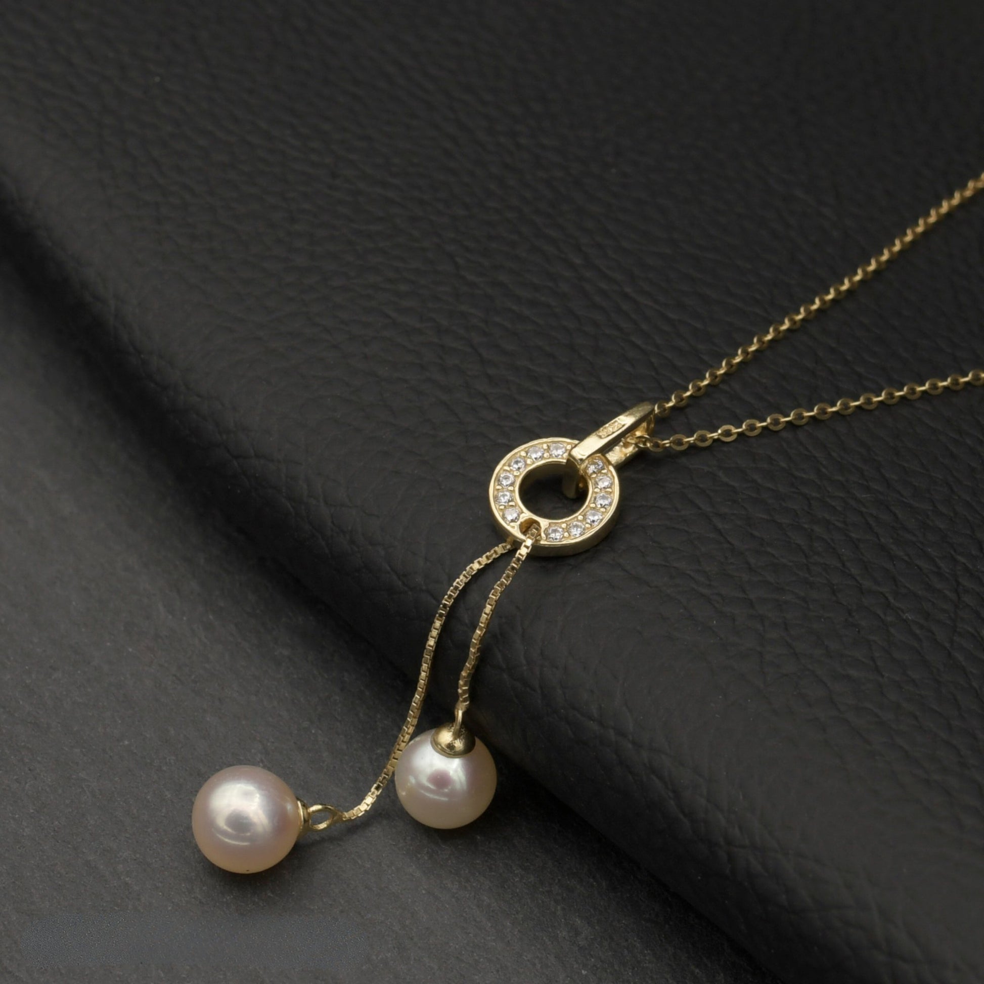 Close-up of the Dancing Pearls Necklace, highlighting its adjustable chain and elegant design.