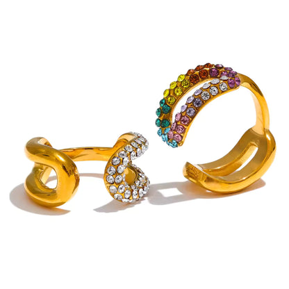 Dazzling Twist Multicolor Crystal Ring Set featuring two gold-plated rings with multicolored and clear crystals.
