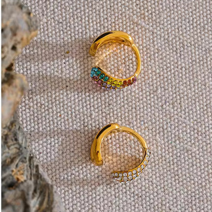 Close-up of the multicolored crystal curved ring and clear crystal twist design in the Dazzling Twist Ring Set.