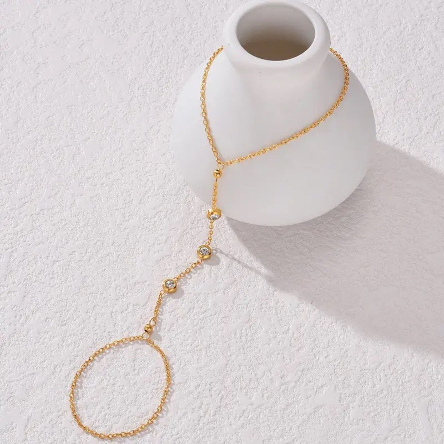 Close-up of the crystal accents and adjustable chains on the Delicate Crystal Hand Chain Bracelet.