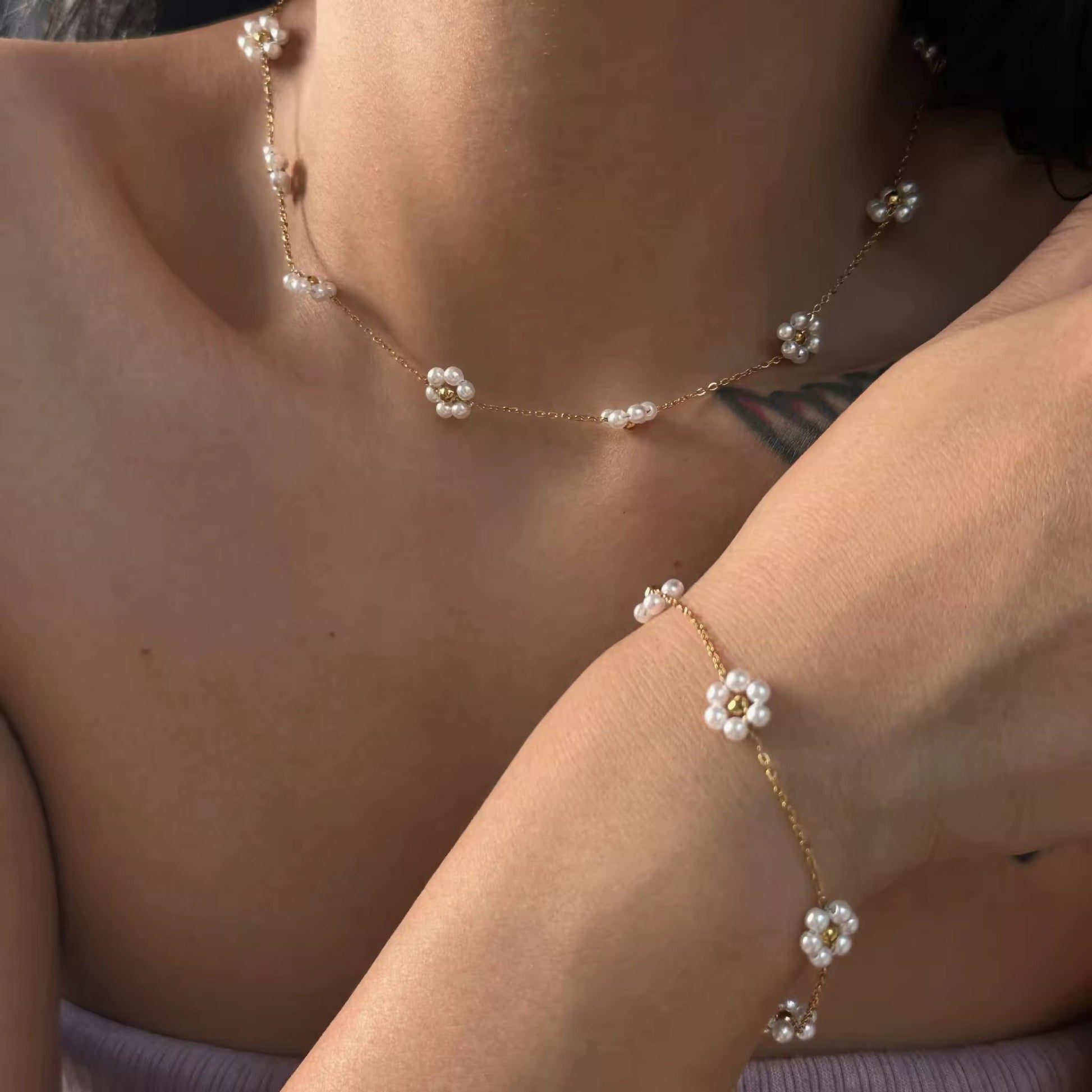 Model wearing the Delicate Daisy Pearl Necklace, showcasing its dainty and elegant look.