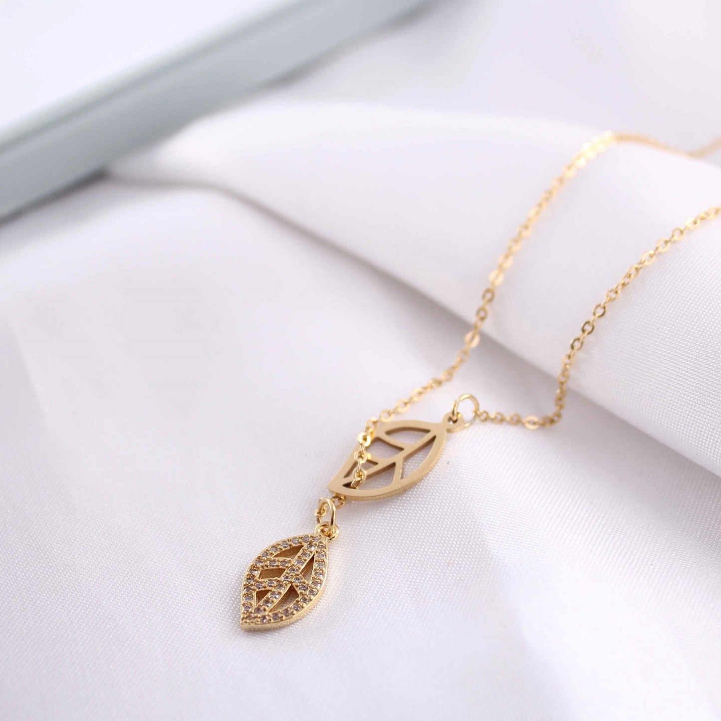 Close-up of the 18K gold-plated leaf pendant design on the Delicate Leaf Pendant Necklace.