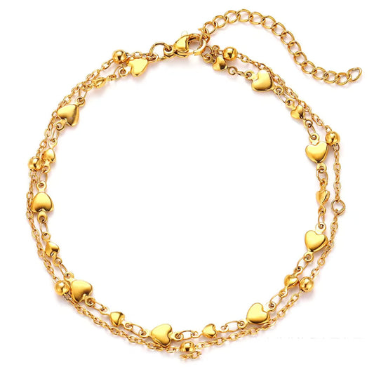 Double Chain Heart Charm Anklet in gold-plated stainless steel with heart accents and delicate beads.