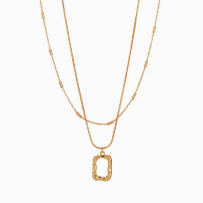 Dual Layer Irregular Pendant Necklace with 18K gold-plated twin chains and an irregular rectangular pendant.