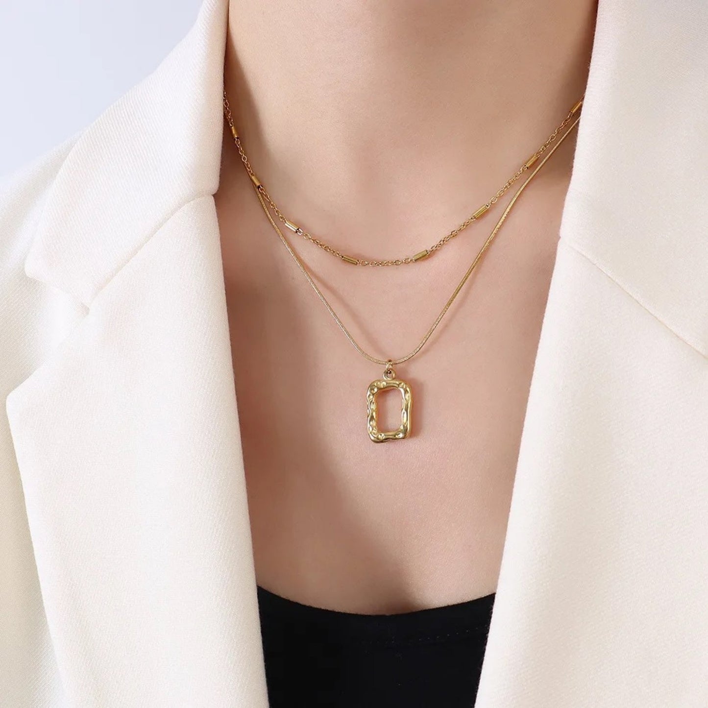 Model wearing the Dual Layer Irregular Pendant Necklace, showcasing its trendy and elegant twin-chain design.