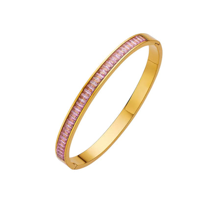 Pink Cubic Zirconia 18K Gold Plated Bangle Bracelet with a sleek hinged closure.