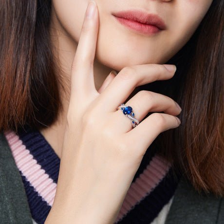 Model wearing a Dark Blue CZ Platinum-Plated Ring, perfect for an elegant occasion.