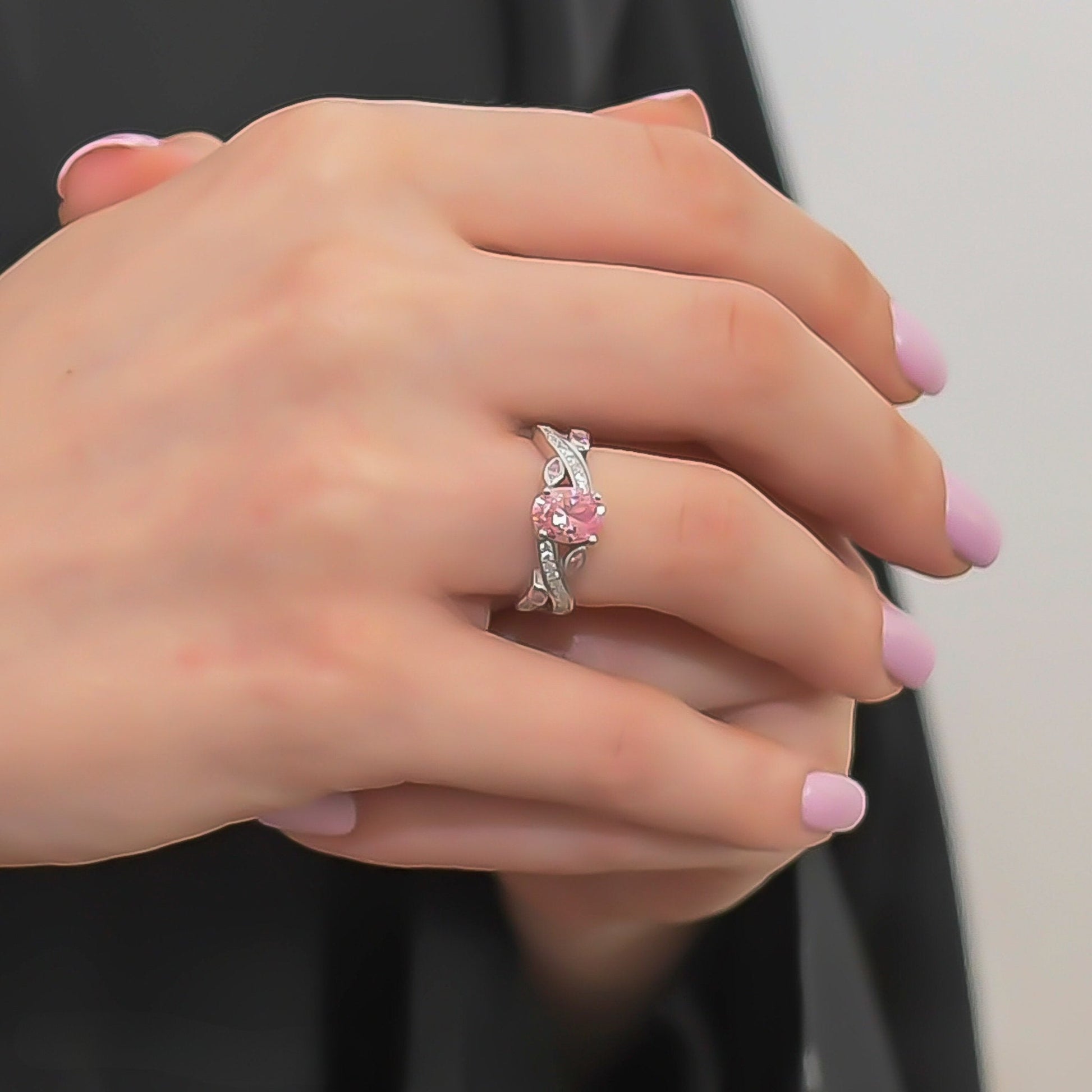 Model wearing a Pink CZ Platinum-Plated Ring, perfect for an elegant occasion.