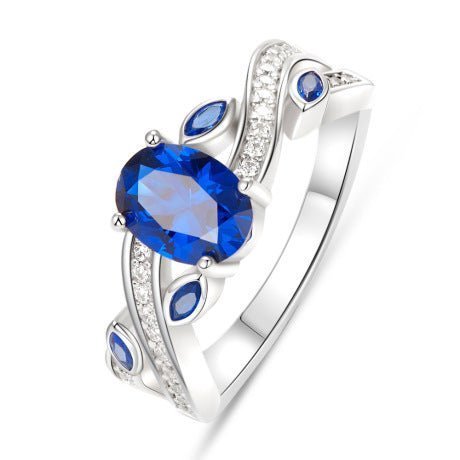 925 Sterling Silver Platinum-Plated Ring with a Dark Blue AAAAA Cubic Zirconia centerpiece and intricate CZ accents.
