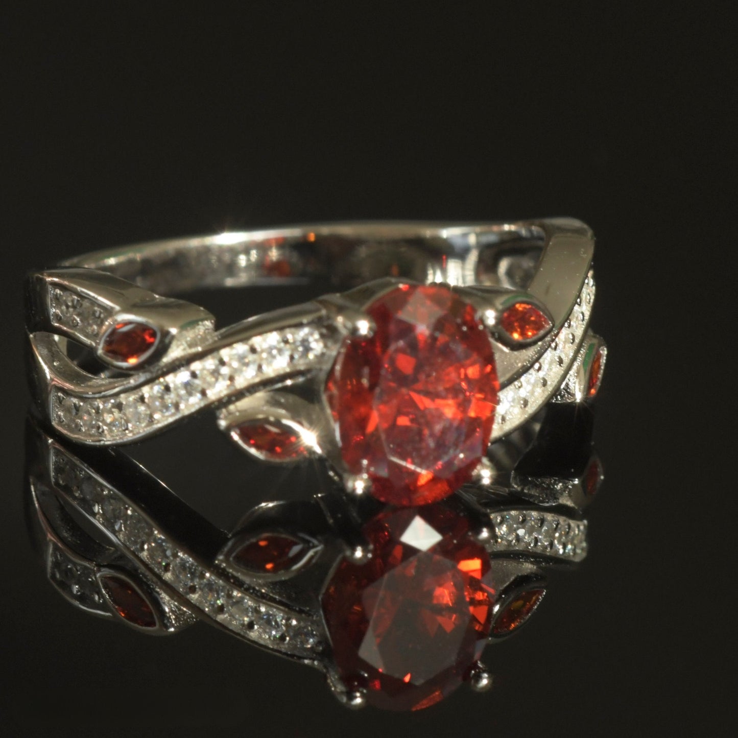925 Sterling Silver Ring with a bold Red CZ centerpiece and detailed CZ accents.