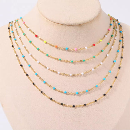 Flat-lay of all four bead options for the Elegant Cascade Necklace Collection: Black, Green, Sky Blue, and Colorful.