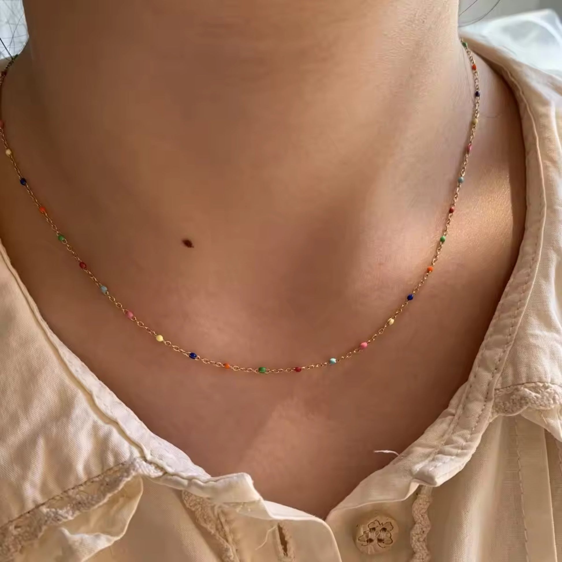 Vibrant colorful bead-accented gold-plated Cascade Necklace displayed on a model.