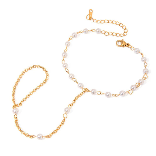Close-up of the Chain-Linked Finger Bracelet showcasing the connecting ring and delicate pearl details.