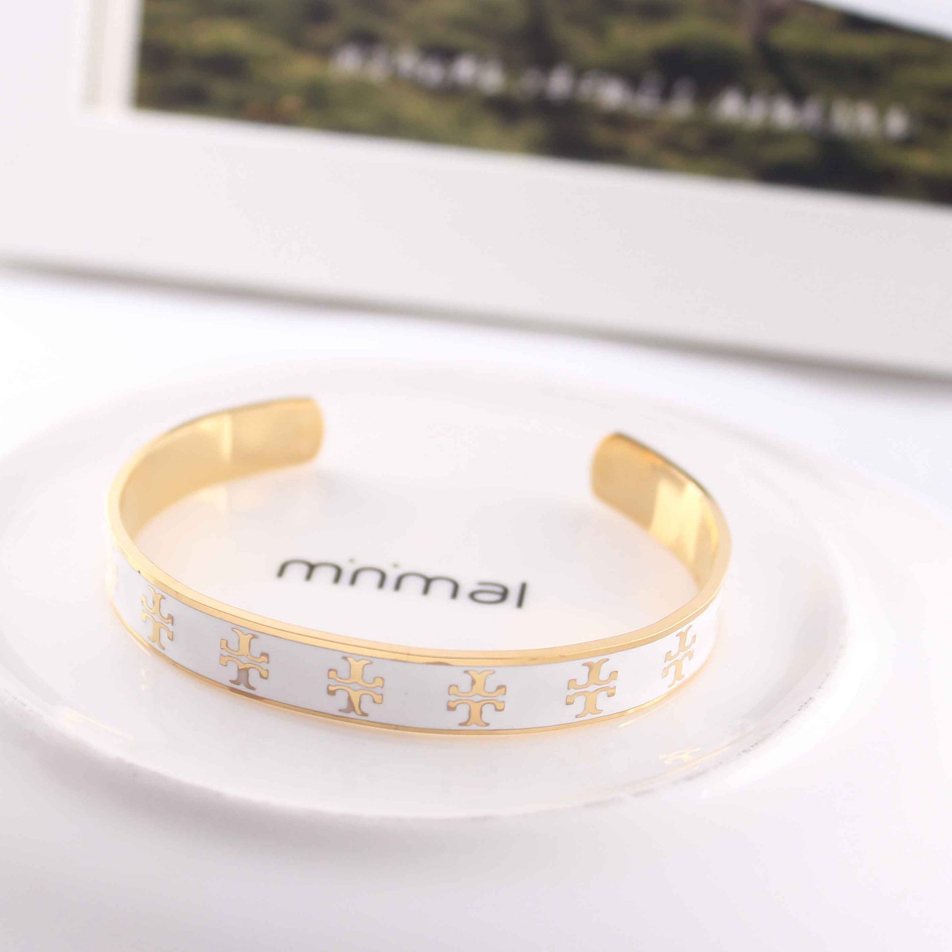 Flat-lay of the Elegant Enamel Cuff Bracelet paired with matching gold accessories for a coordinated set.