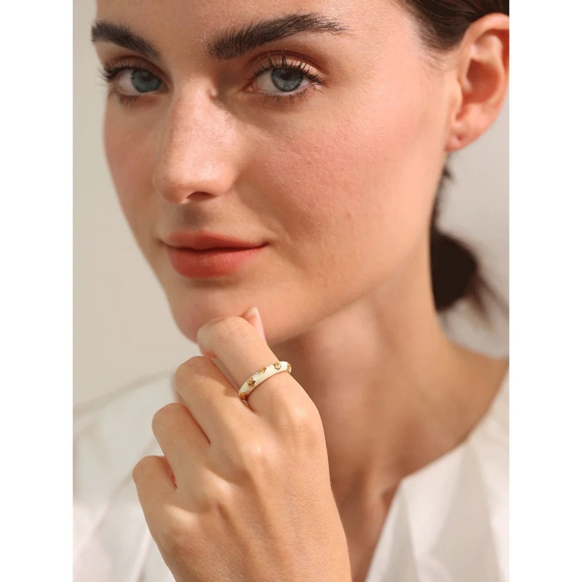Fashionable White Enamel Flower Open Ring styled elegantly on a model's hand.