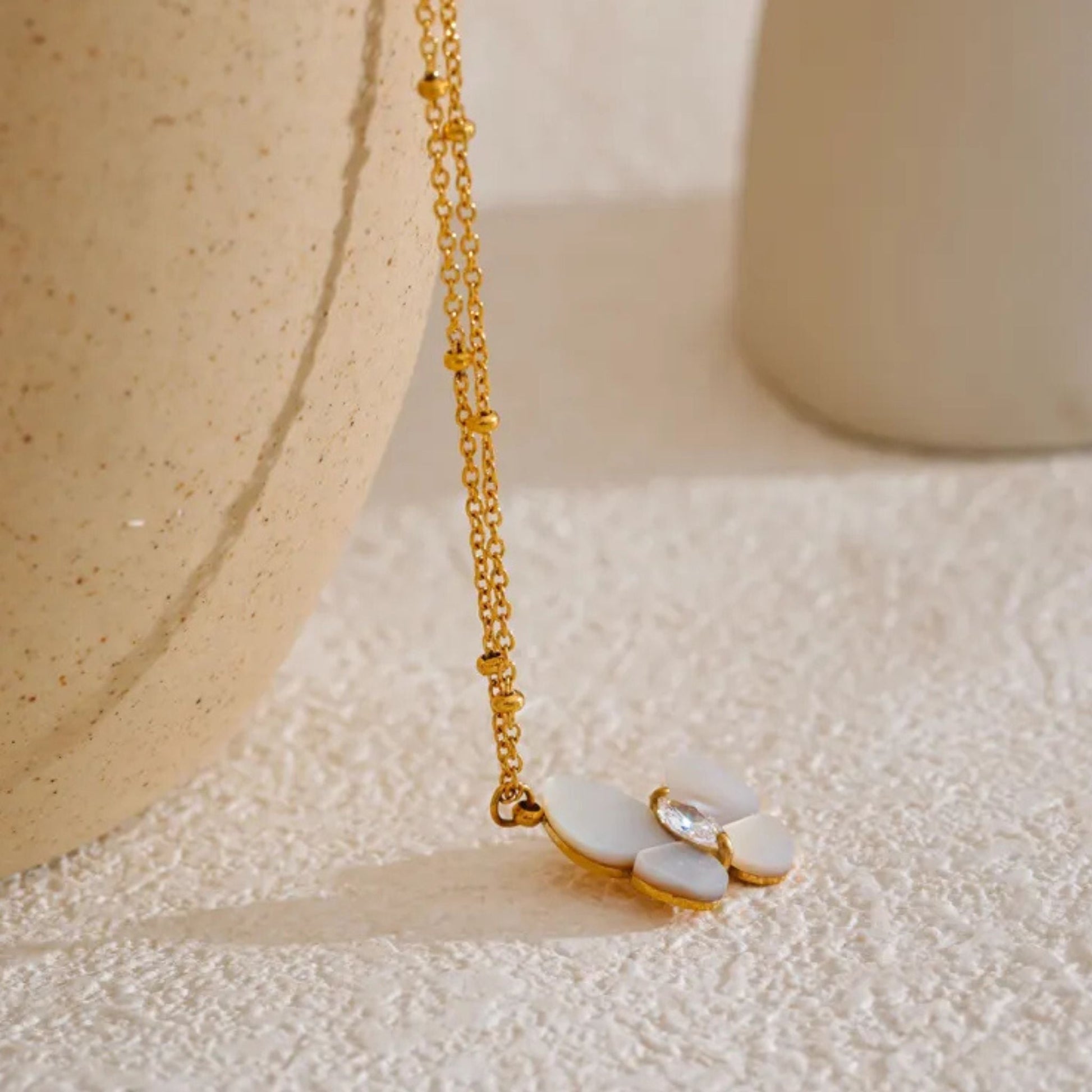 Side View of Flower Pendant with Cubic Zirconia Center
