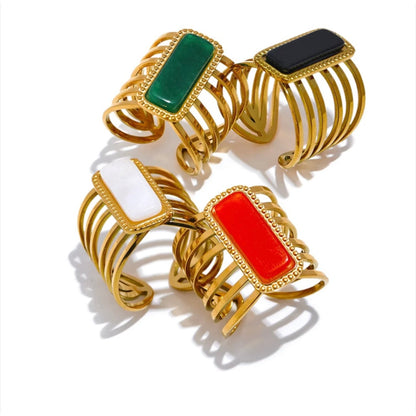Elegant Multicolor Stone Hollow Open Ring with 18K gold plating and orange stone centerpiece displayed on a white background.