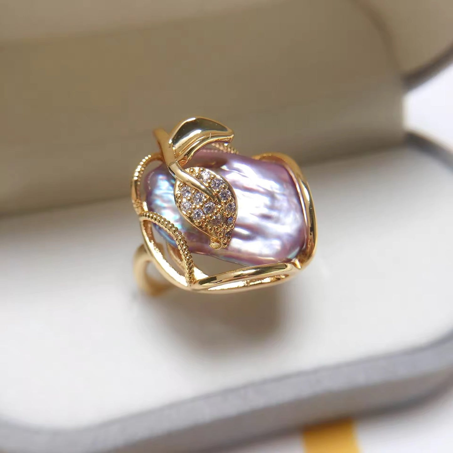 Elegant Pearl Blossom Adjustable Ring in gold with a lustrous purple baroque pearl, perfect for timeless style.