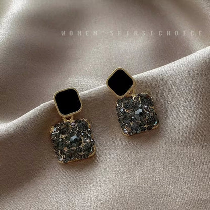 Black Gold-plated square crystal stud earrings with 925 Sterling Silver needles, featuring dazzling crystals.