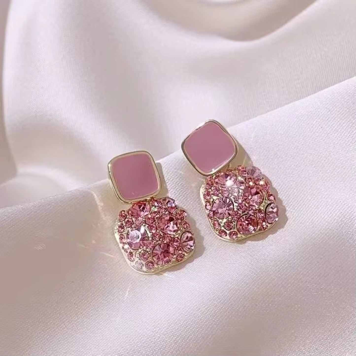 Pink Gold-plated square crystal stud earrings with 925 Sterling Silver needles, featuring dazzling crystals.