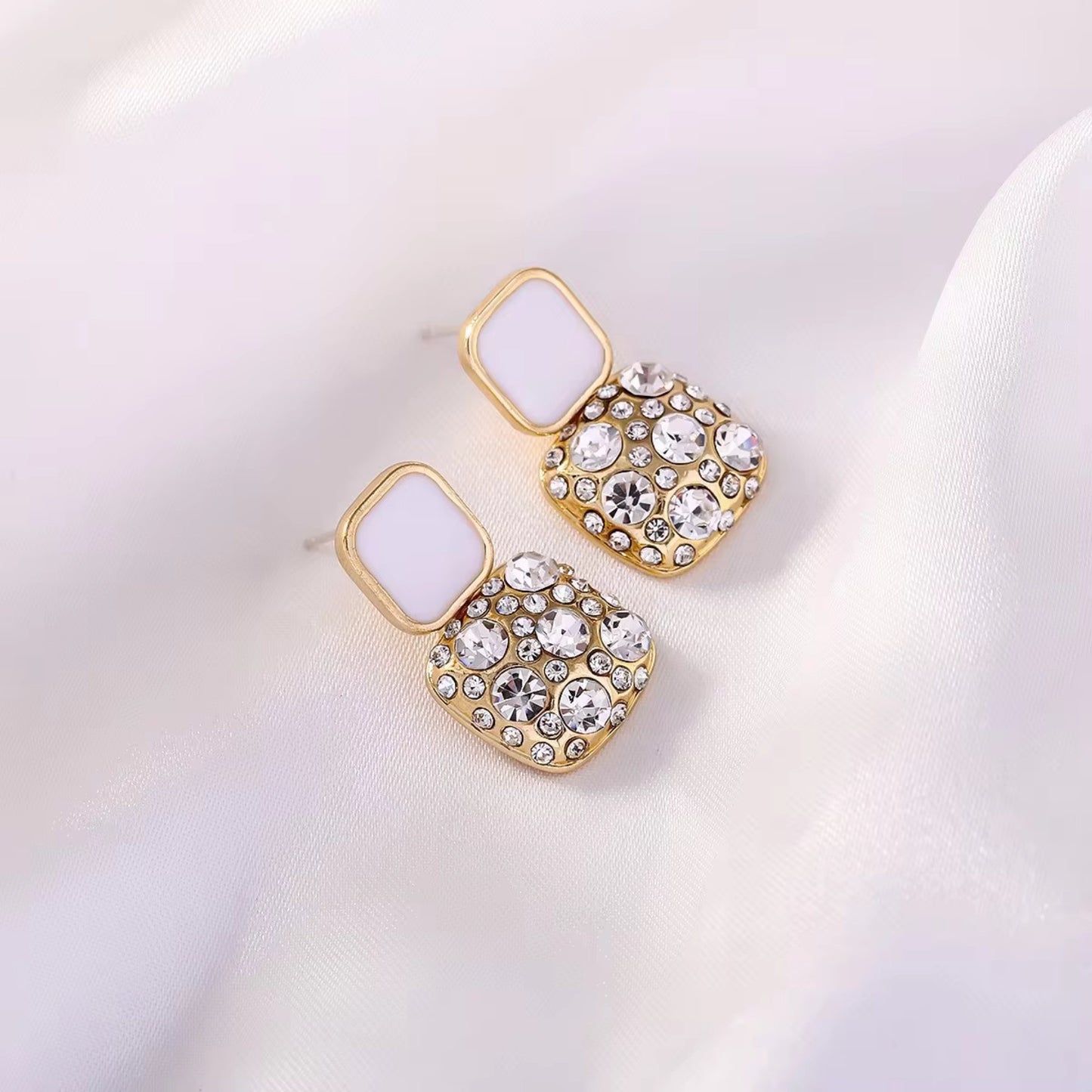 White Gold-plated square crystal stud earrings with 925 Sterling Silver needles, featuring dazzling crystals .