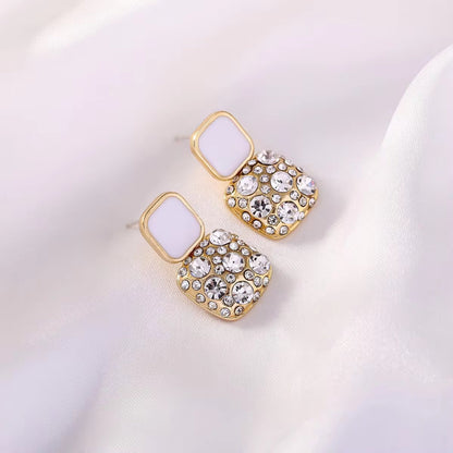 White Gold-plated square crystal stud earrings with 925 Sterling Silver needles, featuring dazzling crystals .