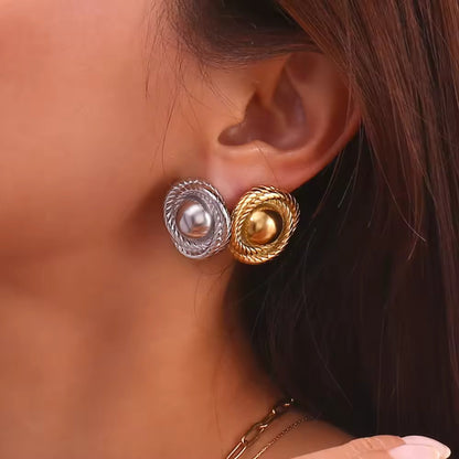 Model showcasing gold and silver-plated twist hoop earrings, styled with a chic evening outfit for a luxurious look.